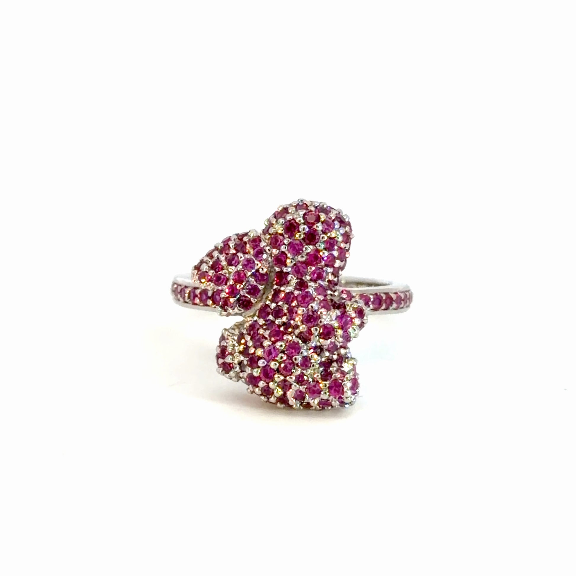 Ring with pink gemstones on a white background